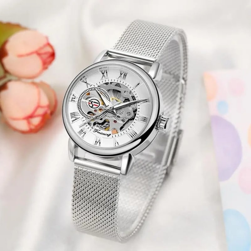 Montre Automatique Femme Bracelet Acier Maille & Cadran Ajouré en argenté avec des fleurs en arrière plan