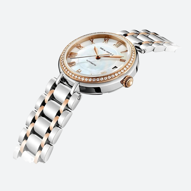 montre automatique femme 32mm nacre et zircon à plat sur fond blanc