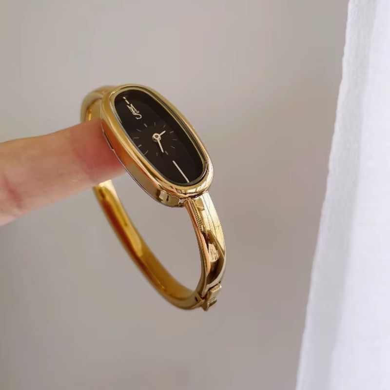 Montre Femme Jonc Doré Cadran Noir Ovale Résistante à l’Eau 