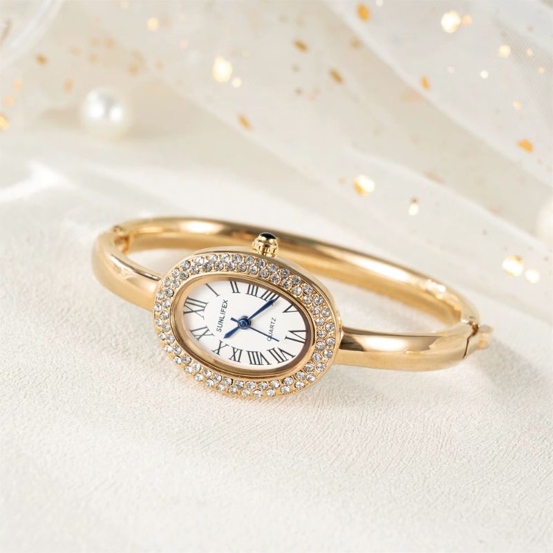 Montre Femme Ovale Dorée Strass Cadran Chiffres Romains Quartz Image
