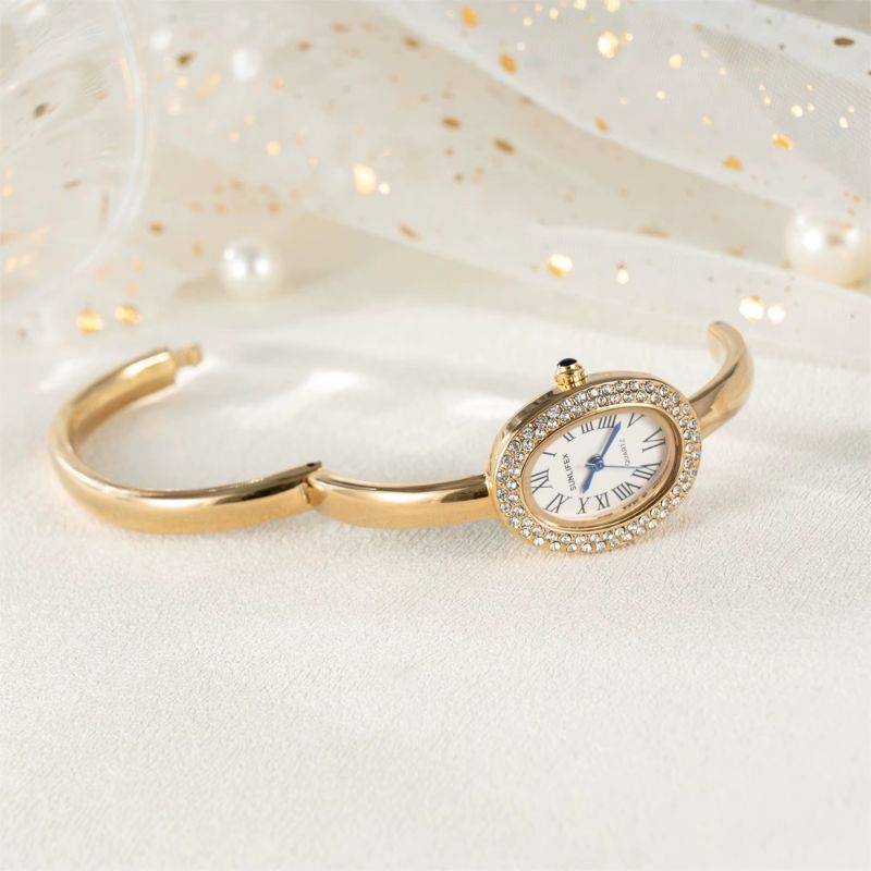 Montre Femme Ovale Dorée Strass Cadran Chiffres Romains Quartz Image
