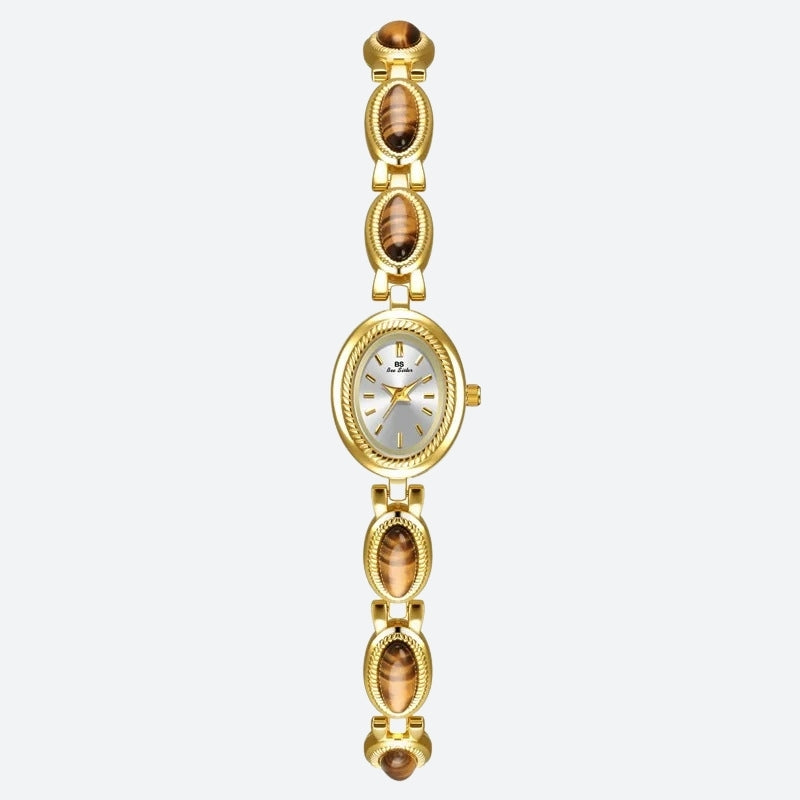 Montre Vintage Ovale pour Femme, boîtier doré avec cadran argenté, bracelet orné de maillons ovales dorés et marron, au style raffiné et intemporel