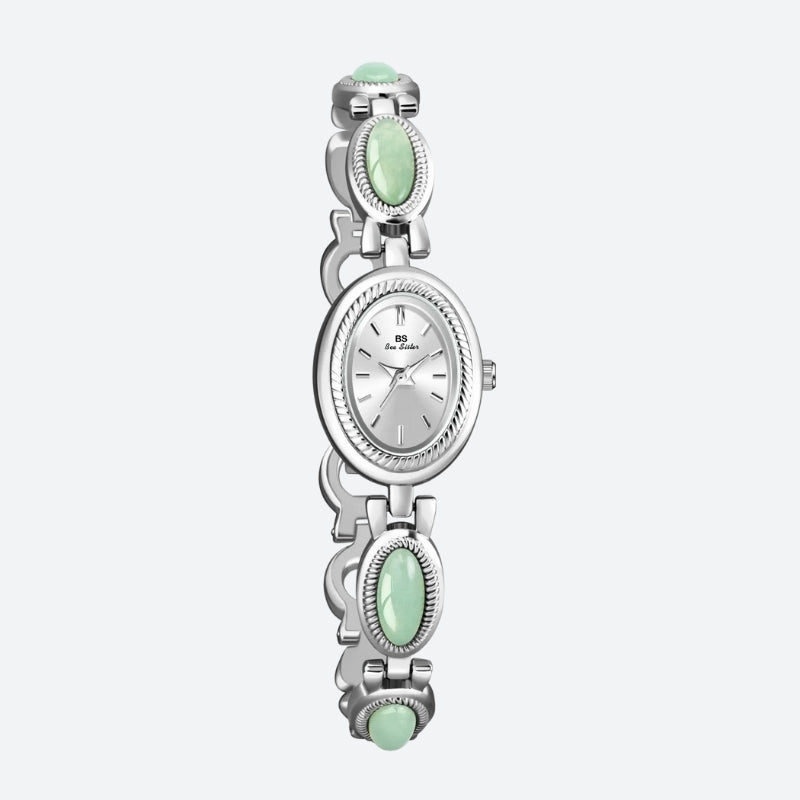 Montre Vintage Ovale pour Femme, boîtier argenté avec cadran argenté, bracelet orné de maillons ovales argentés et verts, design élégant et raffiné