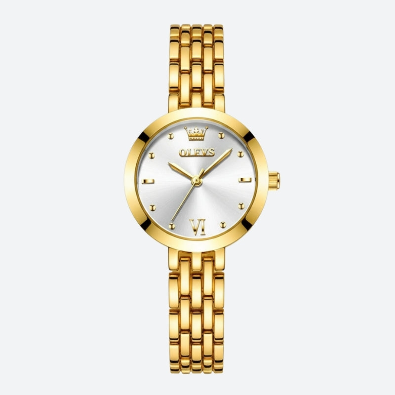 Montre Vintage de luxe pour Femme dorée, cadran argenté élégant et bracelet en acier poli.