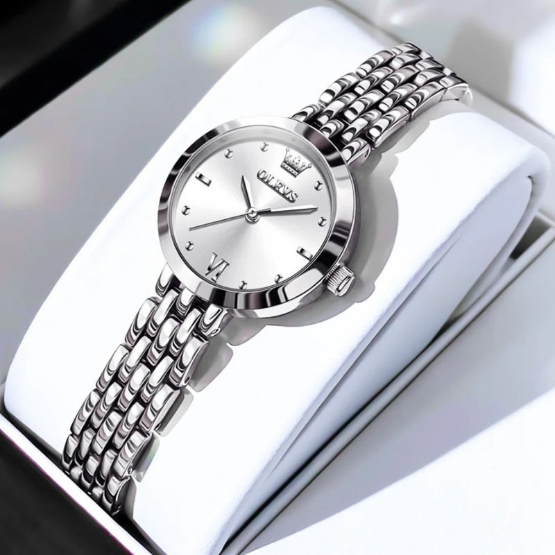 Montre Vintage de luxe pour Femme argentée, cadran argenté lumineux et bracelet en acier inoxydable.