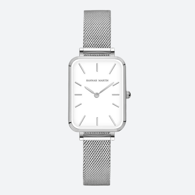 Montre Vintage pour Femme de forme rectangulaire argentée à maille fine, cadran blanc minimaliste et finition brillante.