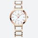 Montre Vintage pour Femme de forme ronde or rose et blanche, cadran blanc minimaliste orné de cristaux et boîtier or rose poli.