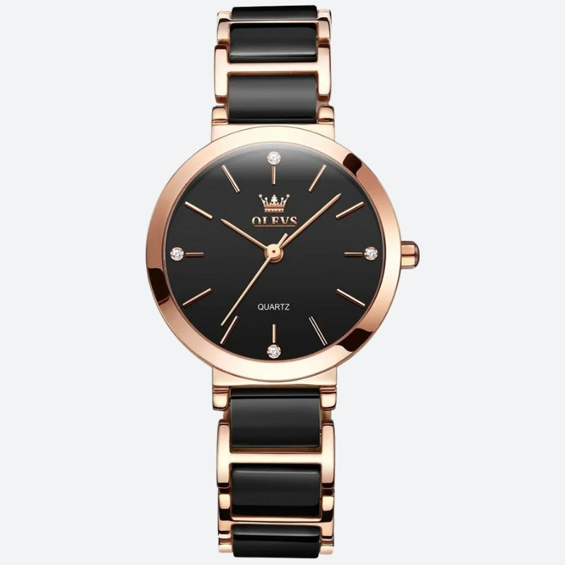 Montre Vintage pour Femme de forme ronde or rose et noire, cadran noir élégant avec index dorés et bracelet céramique noir.