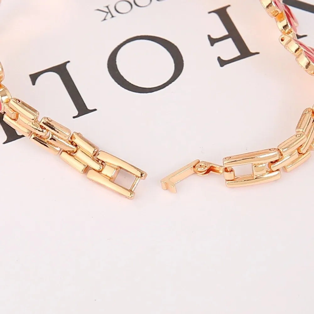 Montre Bracelet Fleur Femme à Cadran Rond et Finition Dorée
