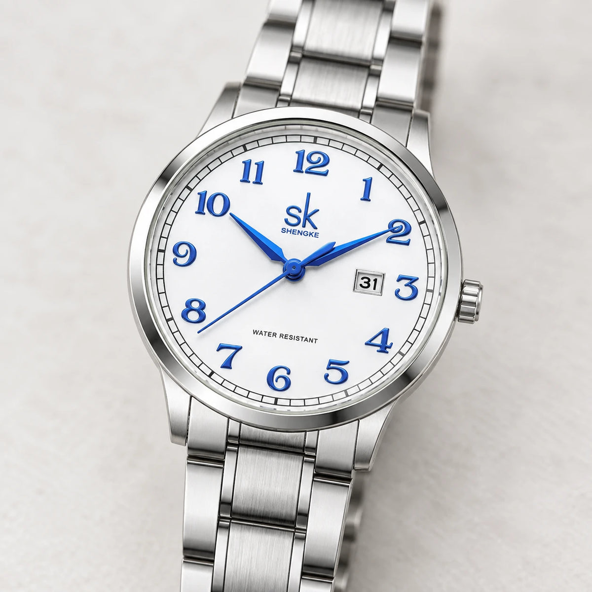 Montre Femme Acier Argenté Cadran Blanc Chiffres Bleus - Détail matière